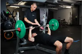 students working out using the bench press
